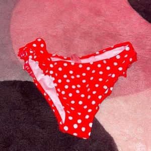 Red abs white polka dotted medium swim suit bottoms.